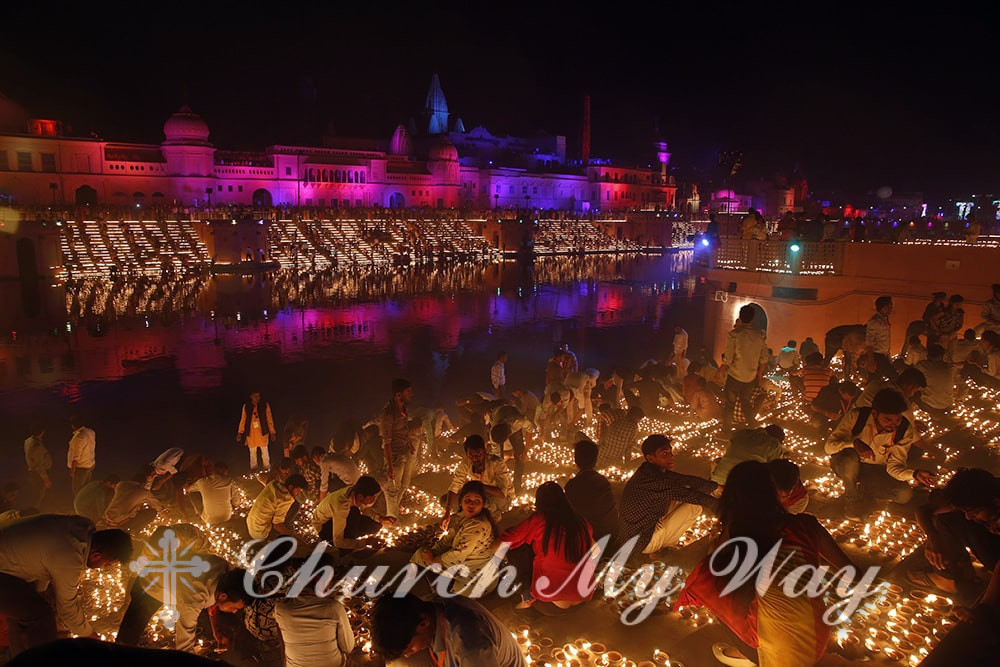 Devotees light earthen lamps on the banks of the River Sarayu as part of Diwali celebrations in Ayodhya, India, on Nov. 6, 2018. The north Indian city of Ayodhya attempted to break the Guinness World Record for most lit earthen lamps on the banks of river Saryu on the occasion of Diwali – the festival of light. (AP Photo/Rajesh Kumar Singh)