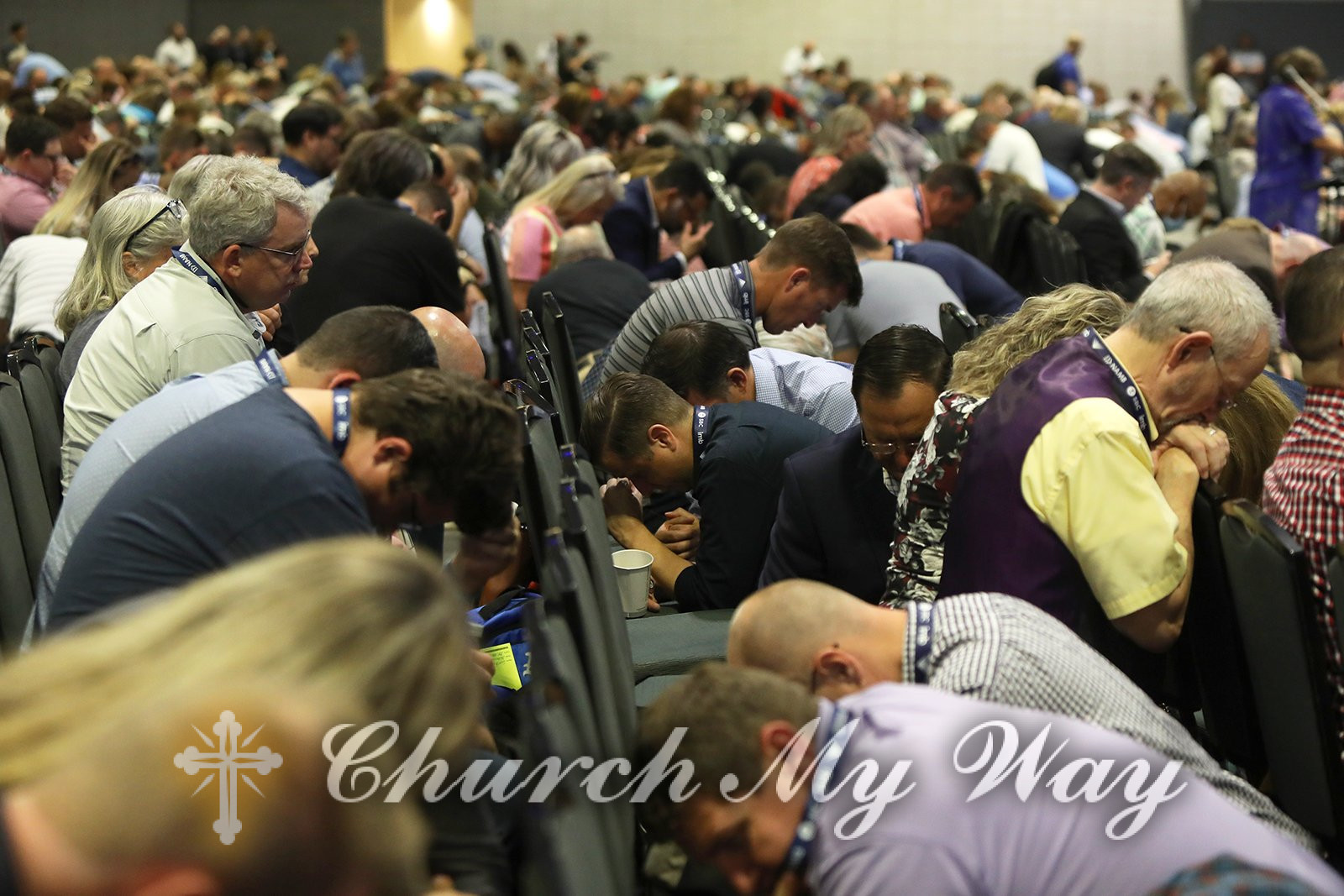 Southern Baptist Convention messengers kneel in prayer during the annual meeting, June 15, 2021, at the Music City Center in Nashville, Tennessee. RNS photo by Kit Doyle