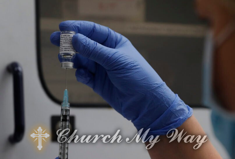 FILE - A vial of the Phase 3 Novavax coronavirus vaccine is seen ready for use in the trial at St. George