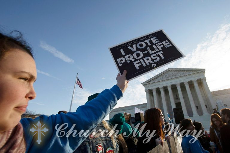 Anti-abortion demonstrators rally outside of the U.S. Supreme Court in Washington, Wednesday, March 4, 2020. (AP Photo/Jose Luis Magana)